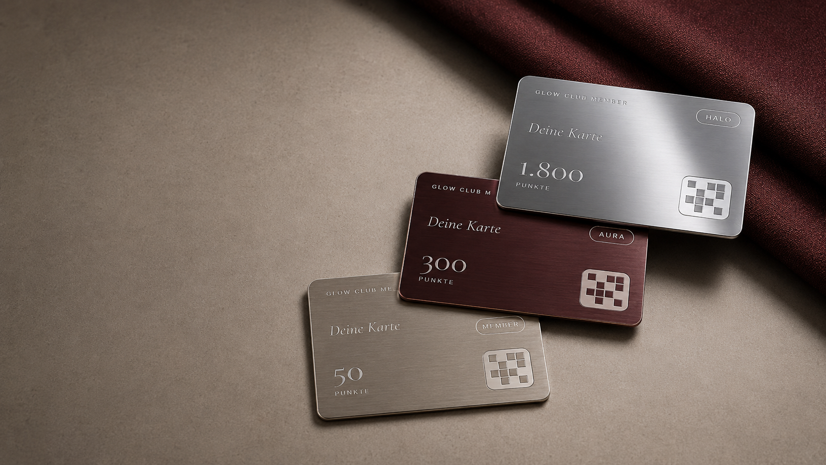 Die drei Member-Card-Level als Metallkarten: Member, Aura und Halo